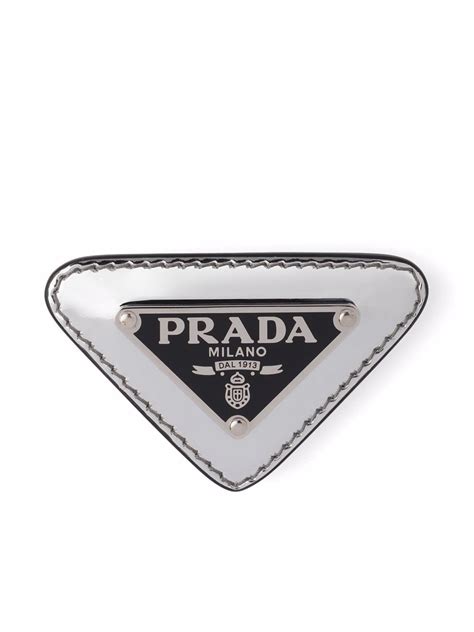 prada classic triangle logo in cream leather with silver plate|fratelli Prada logo.